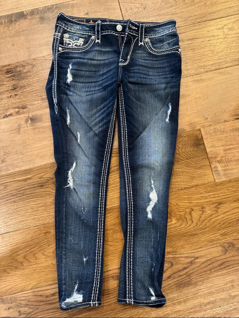 Rock revival Women’s Dark Wash Distressed easy ankle skinny size 25